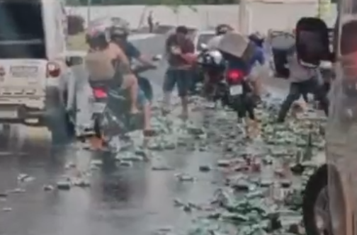 Caminhão tomba e carga de Heineken é saqueada na entrada do Tijucal, em Cuiabá